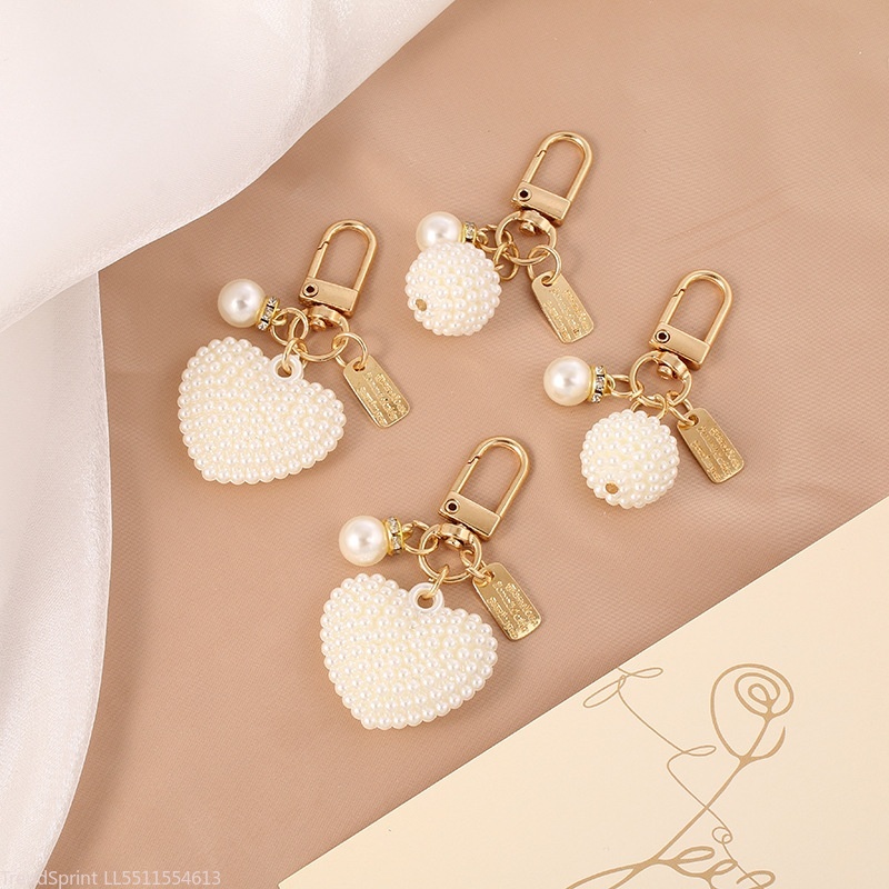 Elegante parelsleutelhangerhan - Women'S Key Accessories recensie en prijs
